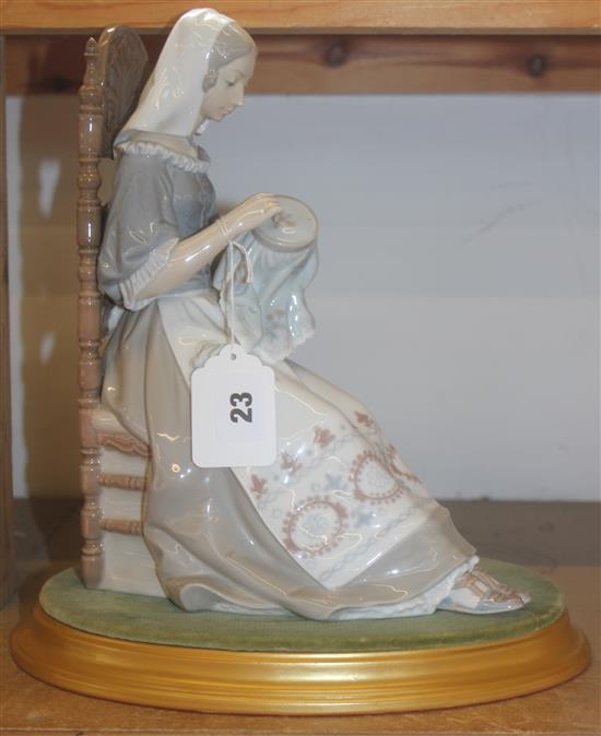 Lladro figure of a seated girl sewing